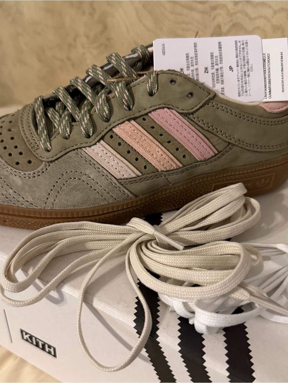 Adidas  Women’s KITH Olive Suede Sneakers with Pink Stripes.